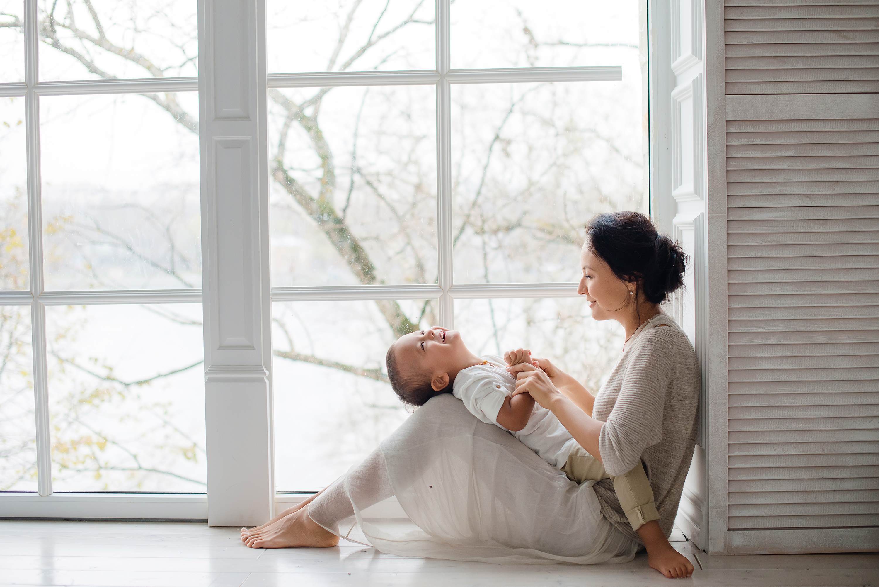 Women and child sat on floor