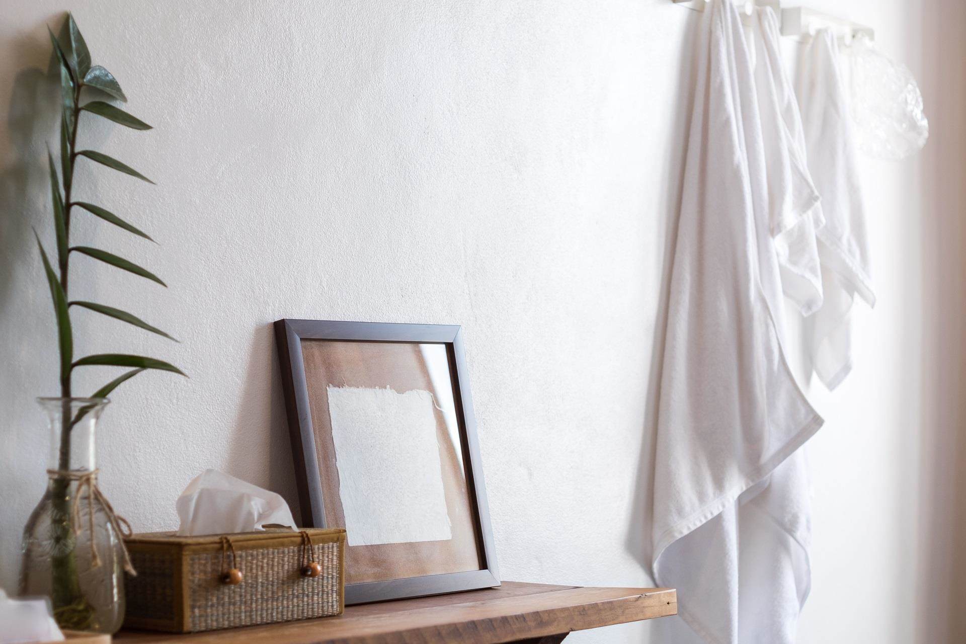 Tissue box on table with greenery around