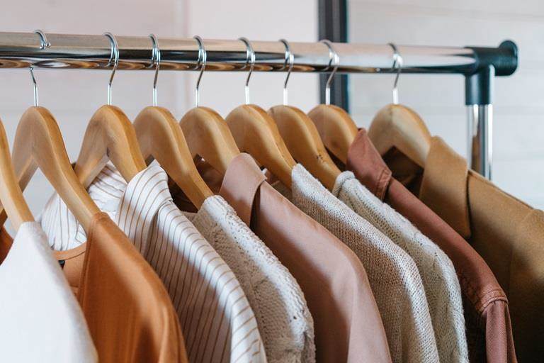 Blue clothes hung up on coat hangers